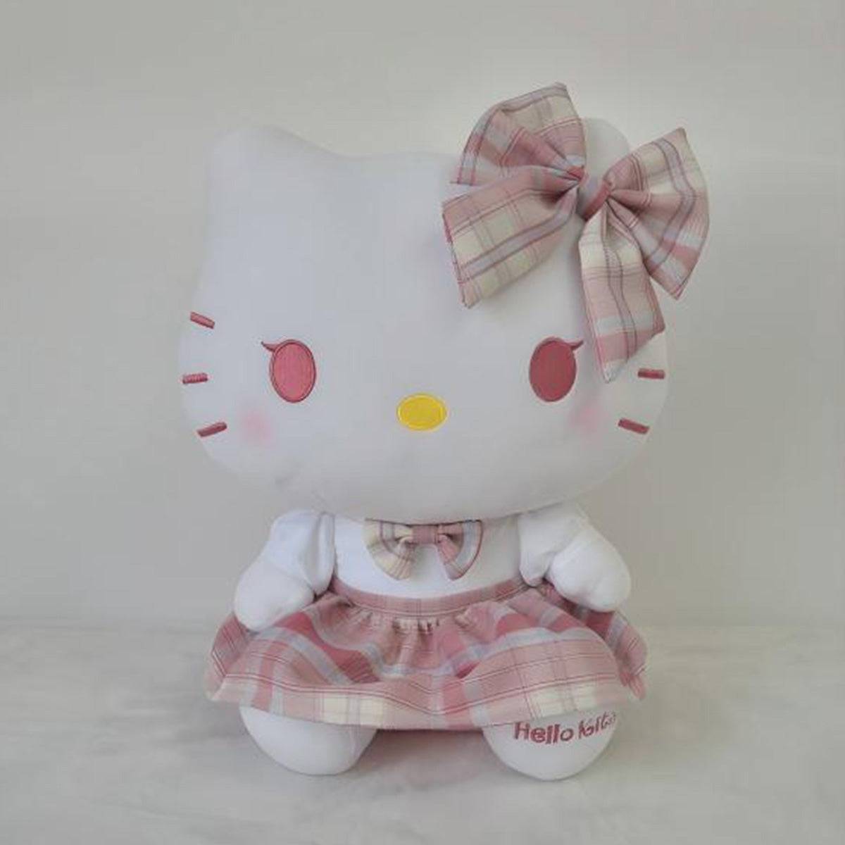 Sanrio JK Series Hello Kitty plush toy 28cm in a soft pink plaid schoolgirl outfit, with embroidered details. A perfect plush for Hello Kitty lovers.