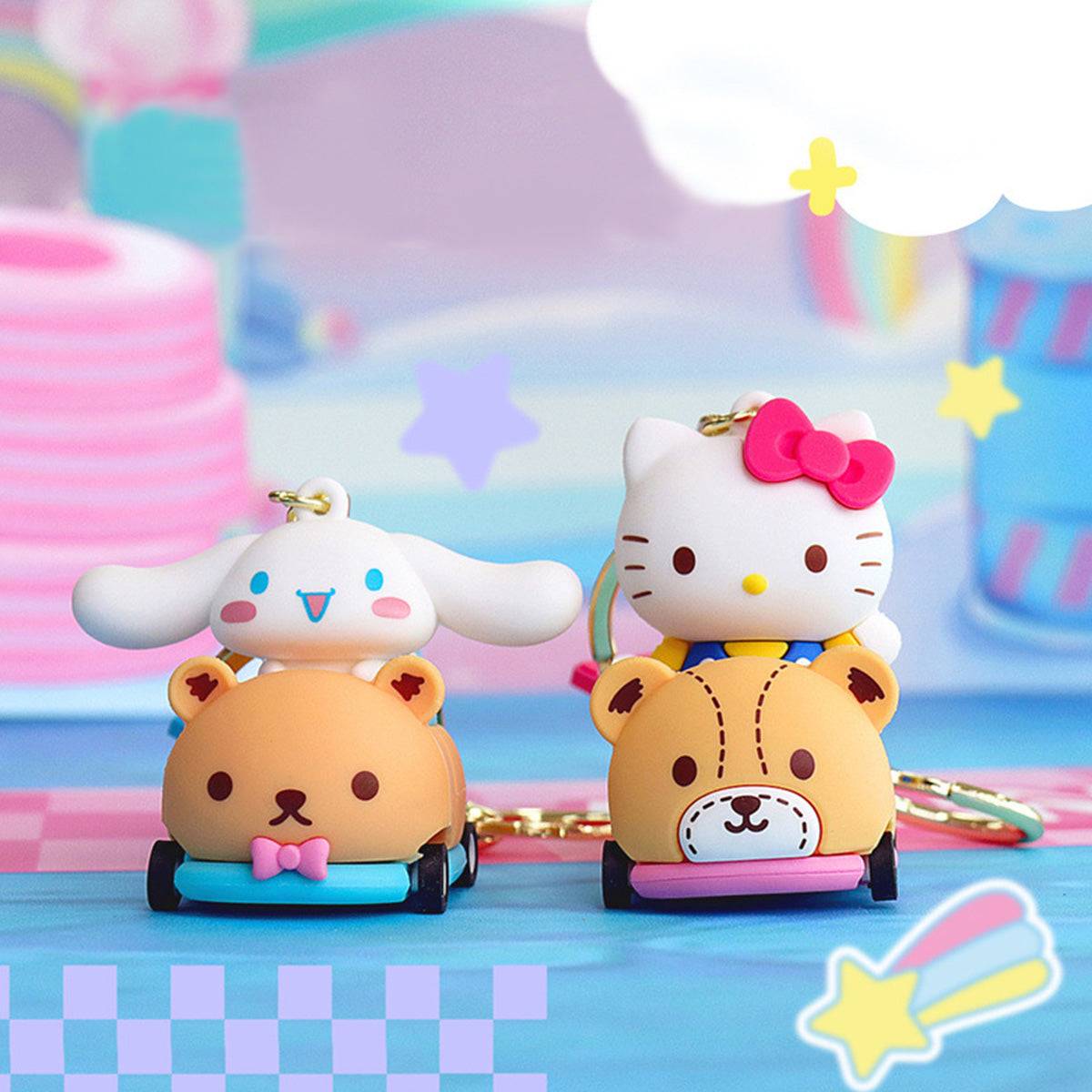Hello Kitty and Cinnamoroll Sanrio keychains in bear-themed race cars with rolling wheels, set against a pastel racing background.