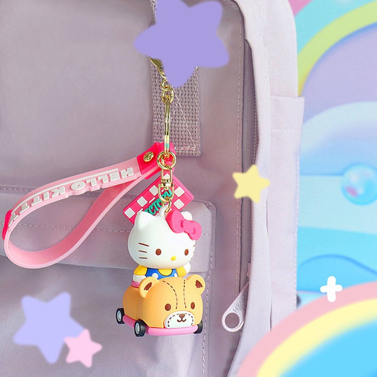 Hello Kitty Sanrio race car keychain attached to a pastel pink backpack, featuring a rolling wheel design.
