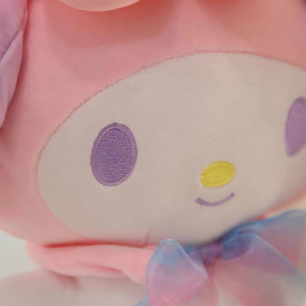 Close-up of My Melody plush toy’s embroidered face, showcasing soft pastel colors, delicate stitching, and a charming smile for Sanrio fans.