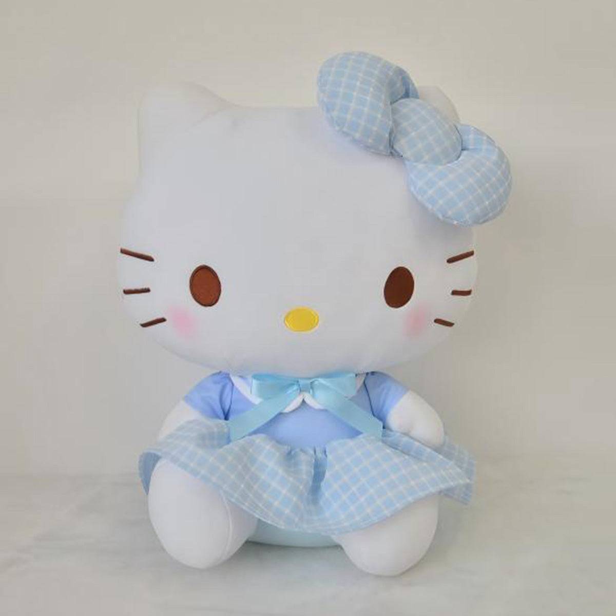 Sanrio Hello Kitty plush toy in a blue uniform-style dress with a matching bow. A soft and adorable stuffed toy for fans and collectors.