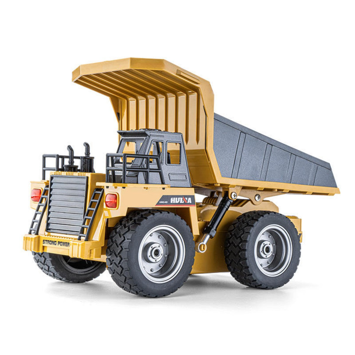 Close-up of Huina 1533 1:18 semi-alloy remote control dump truck with realistic detailing and rugged tires for off-road RC fun.