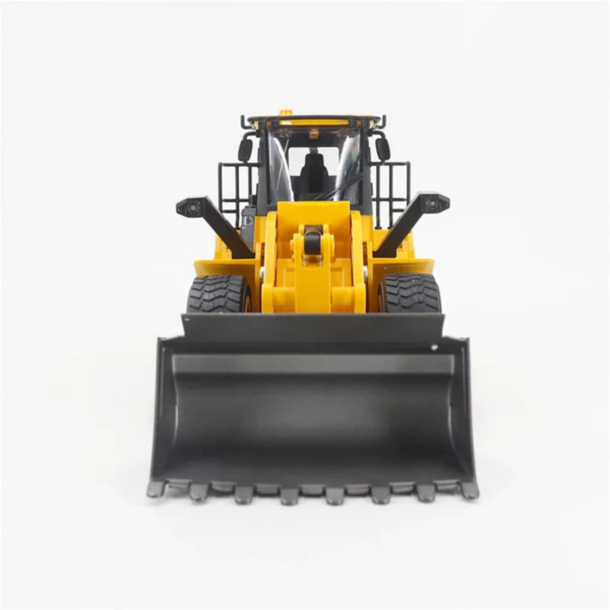 Front view of Huina 1552 1:16 Alloy RC Wheel Loader highlighting large bucket and rugged tires for realistic construction toy action.