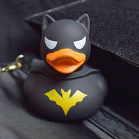 Lilalu Rubber Duck in a superhero costume with a black cape and bat symbol. A heroic bath toy from the Lilalu Rubber Ducks Baby Bath Toys Blind Box.