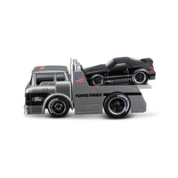 Side view of Maisto Muscle Machines Transports 1:64 diecast truck carrying a black Ford Mustang. Authentic detailing and branding.