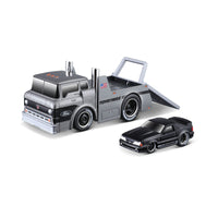 Maisto Muscle Machines Transports 1:64 diecast truck with a black Ford Mustang on a flatbed. Detailed design with Toyo Tires branding.