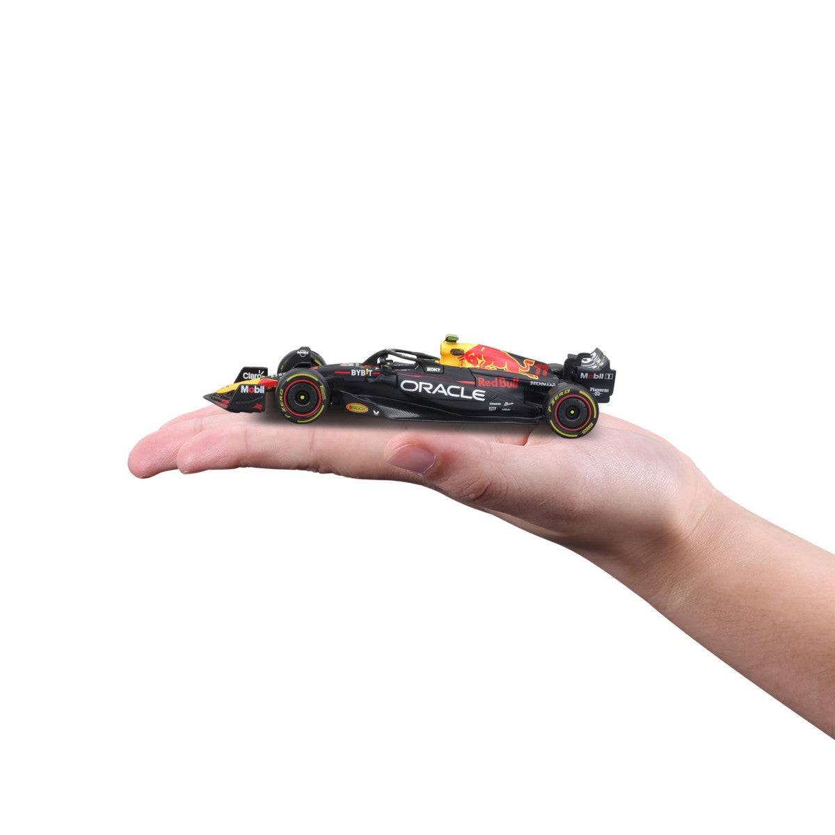 Bburago 1:43 F1 Car Model 2023 Red Bull Racing RB19 #11 Sergio Pérez displayed on a hand, demonstrating its compact and collectible size.