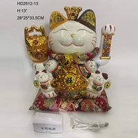 13-inch Lucky Cat Figurine with crown and gold accents, seated on red cushion. Comes with USB power adapter for decorative use.