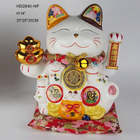 White 14-inch Lucky Cat Figurine with gold coin medallion and floral ears, seated on red cushion. Perfect for home or office decor.