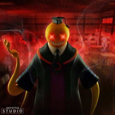 Koro Sensei figure from ABYstyle Studio in a dramatic red-lit classroom setting, showcasing his menacing yet charismatic presence from Assassination Classroom.