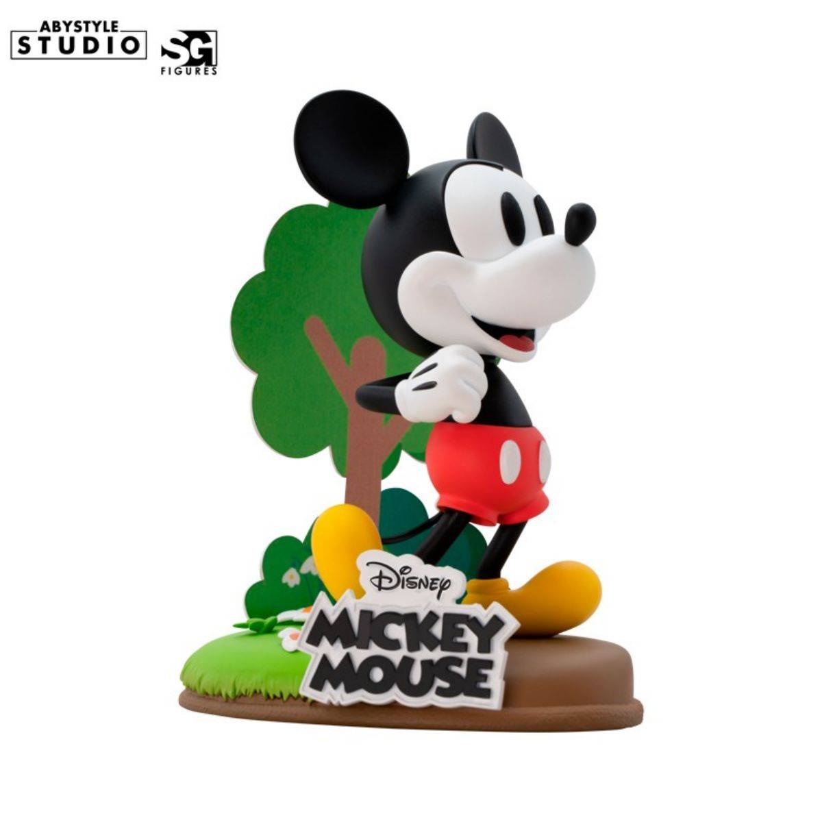 ABYstyle Studio Disney Mickey Figure 10cm featuring classic Mickey Mouse in red shorts and yellow shoes, posed on a scenic base with a tree backdrop.