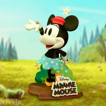 Disney Minnie Mouse figure by ABYstyle Studio in a scenic background. This 10cm collectible celebrates her Steamboat Willie appearance.