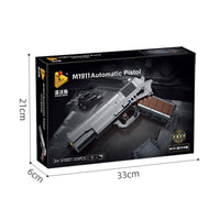 Packaging of the Panlos Brick M1911 Automatic Pistol building block set, featuring a black box with product dimensions.