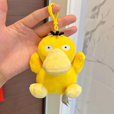 Hand holding the Pokemon Plush Psyduck Keychain 10.5cm, showcasing its compact size and soft texture. Ideal for Pokemon fans and collectors.