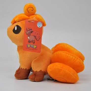 Side view of the Pokemon Vulpix Plush Toy 24cm, showcasing its curled tail and premium stitching. Perfect soft toy for cuddling and gifting.