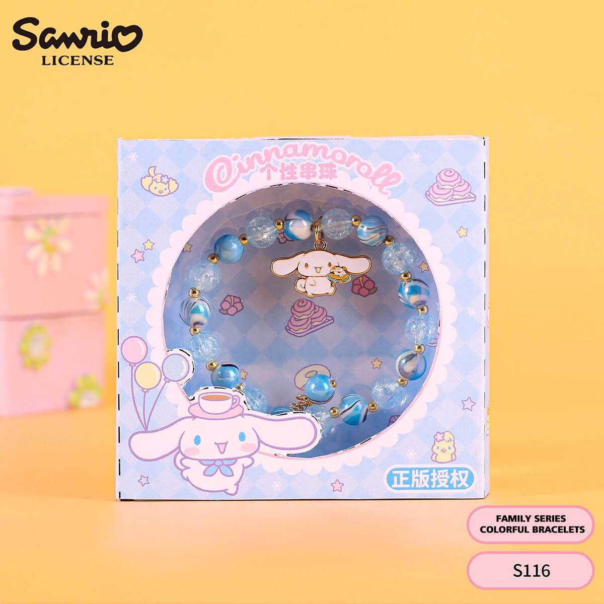 S116 Sanrio Cinnamoroll rainbow beaded bracelet in blue packaging with glossy beads and a Cinnamoroll charm. A charming accessory for anime lovers.