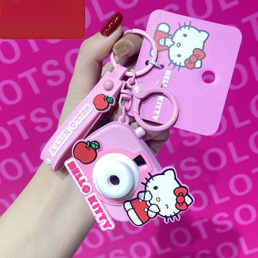 Pink Hello Kitty Sanrio Characters Cute Camera Pendant Keychain featuring a projector light and apple-themed design.