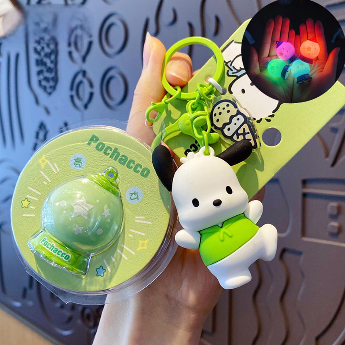 Sanrio Characters Keychain with Night Light featuring Pochacco. A green keychain with a glowing night light charm, great for fans.