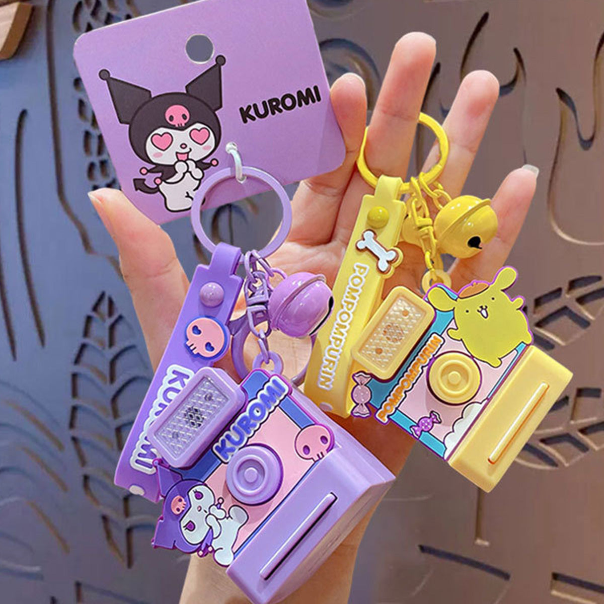 Kuromi and Pom Pom Purin Sanrio Characters Polaroid Camera Keychains held together, showcasing their cute and colorful designs for fans and collectors.