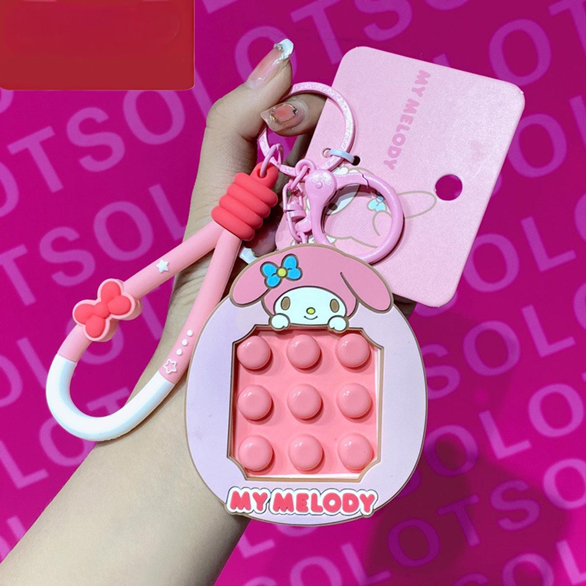 My Melody Pop It Fidget Keychain in pink with a matching carabiner clip. A charming Sanrio keychain that doubles as a stress-relief toy.