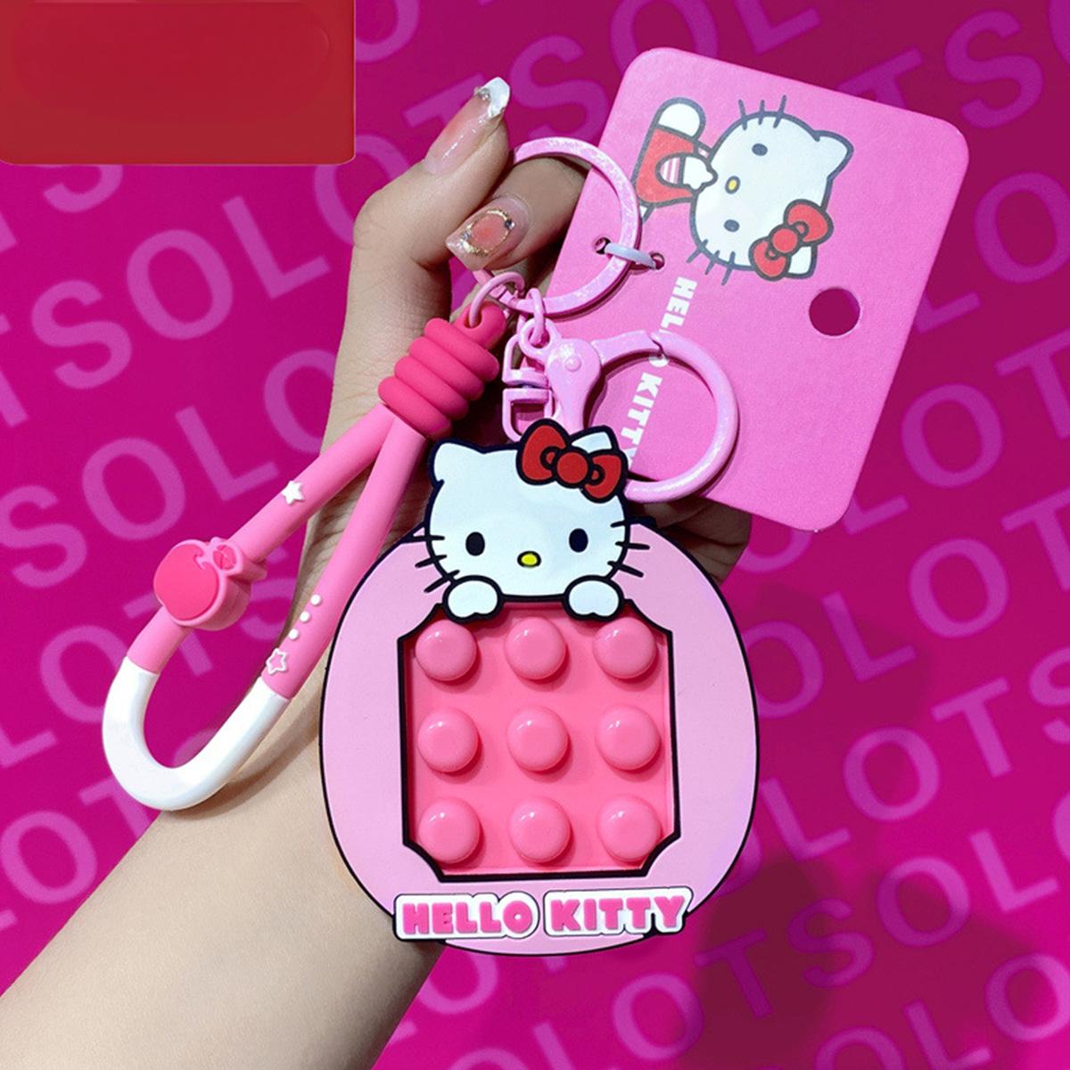 Hello Kitty Pop It Fidget Keychain in pink with a matching carabiner clip. A stylish and fun Sanrio accessory perfect for fidgeting.