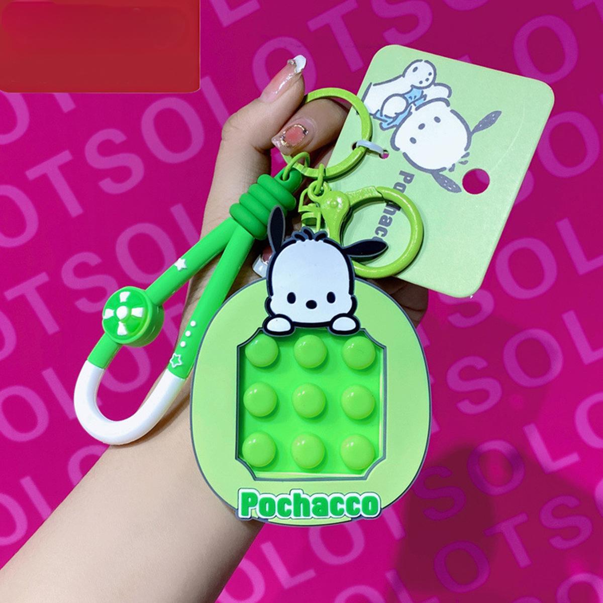 Pochacco Pop It Fidget Keychain in green with a matching carabiner clip. A playful and practical Sanrio keychain for stress relief.