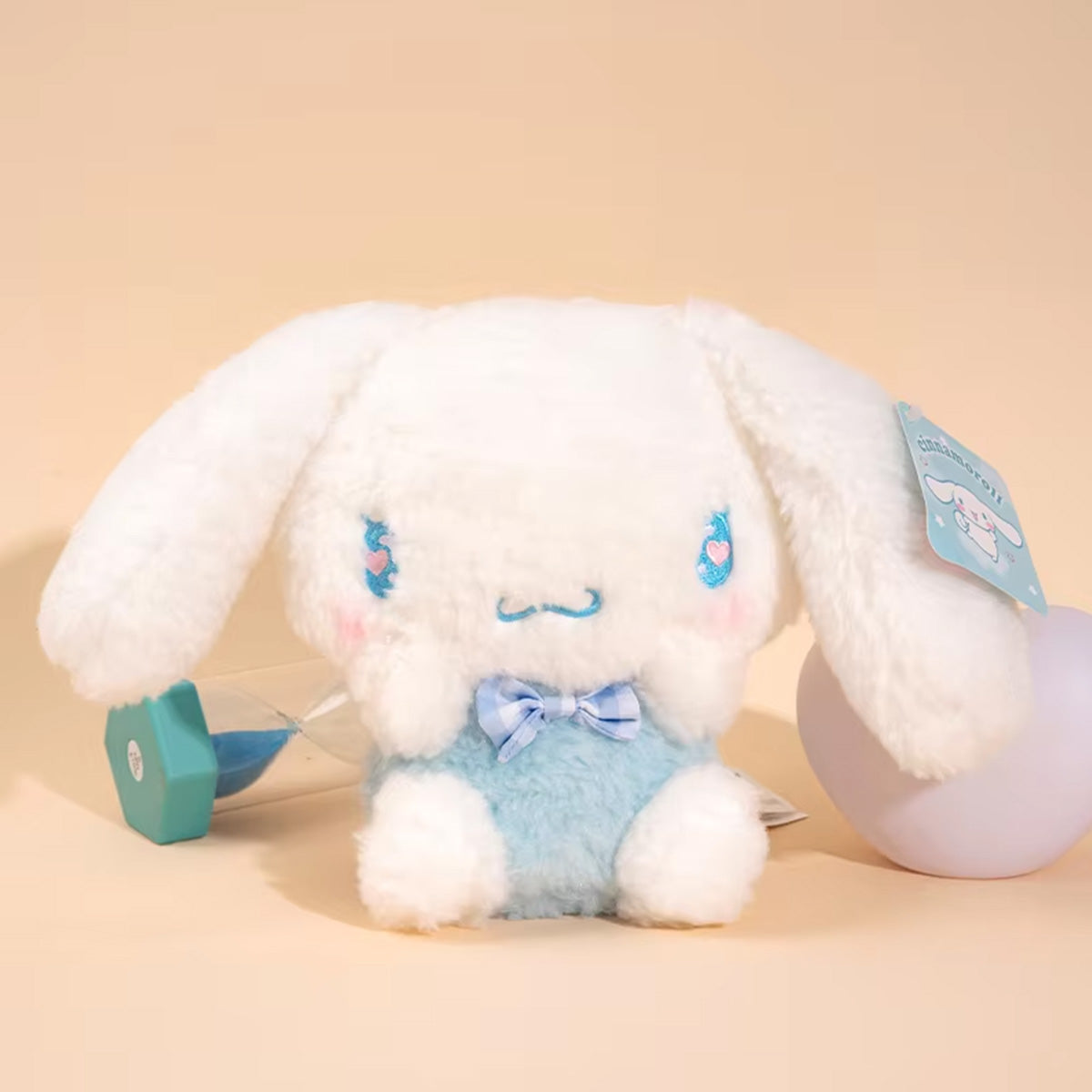 Sanrio Cute Justice Series Cinnamoroll plush keychain 10cm, showcasing white fur, blue outfit, and a charming bow tie.