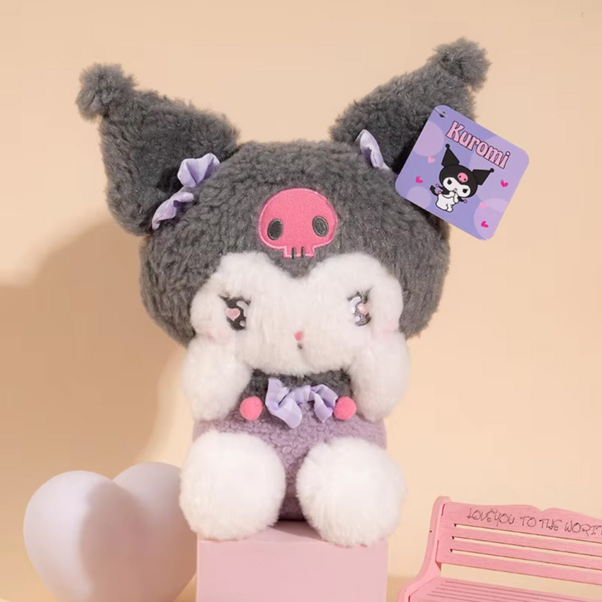 Sanrio Cute Justice Series Kuromi plush keychain 10cm, designed with fluffy gray fur, a skull emblem, and delicate ribbon accents.