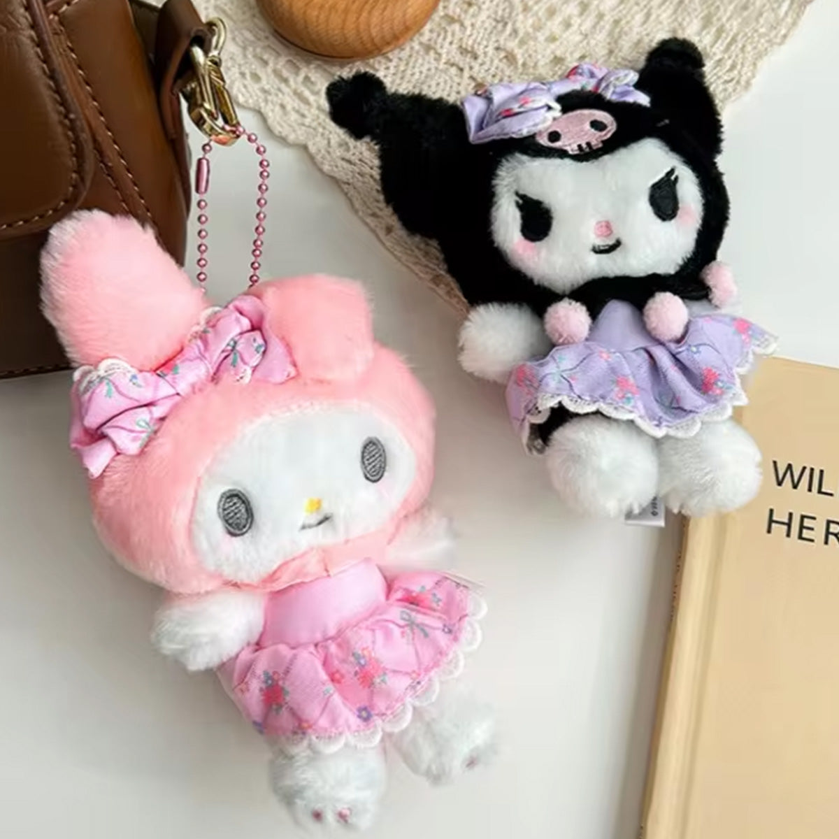 Sanrio Flower Fairy Series plush keychains featuring My Melody and Kuromi in floral dresses. Perfect for decorating bags or collecting.