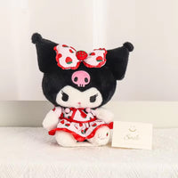 Sanrio Fresh Strawberry Series Plush Keychain 12cm featuring a black and white character with a strawberry-patterned bow and dress, sitting with a confident expression.