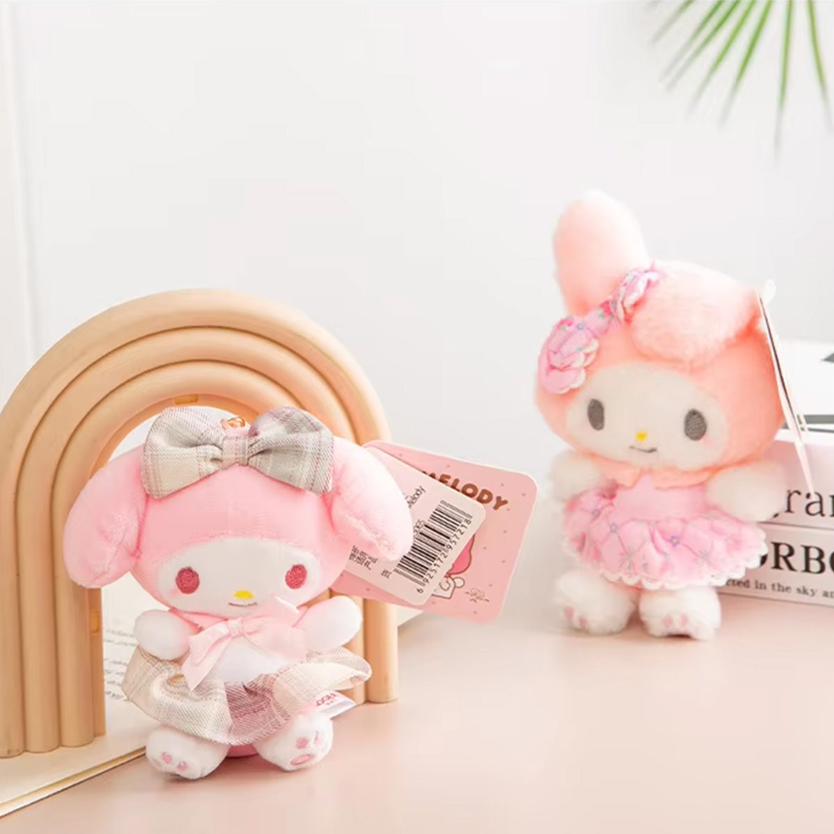 Sanrio Sakura Series Plush Keychain 10cm featuring My Melody in a pink dress with floral accents. A soft and adorable plush keychain for collectors.