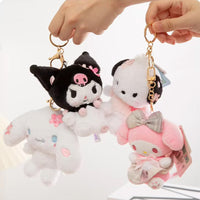 Sanrio Sakura Series Plush Keychain 10cm set held in hand, showcasing Kuromi, Pochacco, Cinnamoroll, and My Melody. A perfect gift for Sanrio lovers.