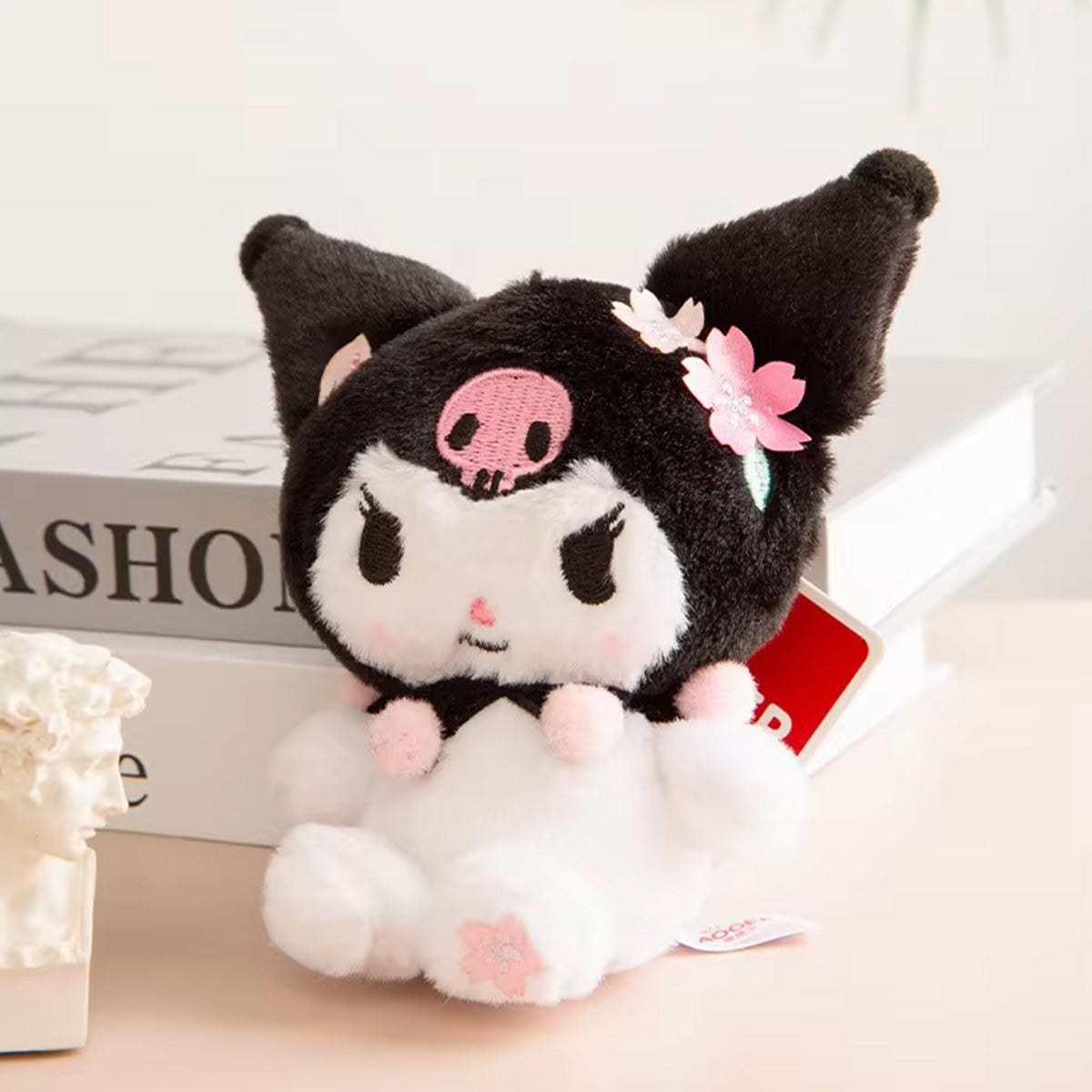 Sanrio Sakura Series Plush Keychain 10cm featuring Kuromi with black and white plush, pink cherry blossom details. Perfect for Sanrio fans and collectors.