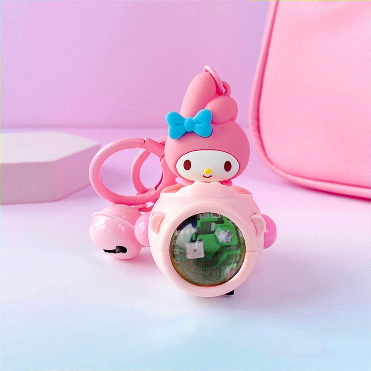 Sanrio Sunset Light Spaceship Keychain featuring My Melody in pink with a glowing light. A cute accessory for bags and keys, perfect for fans.