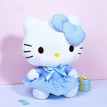 Hello Kitty plush toy from the Sanrio Uniform Series, dressed in a blue checkered outfit. A charming collectible gift for Hello Kitty lovers.